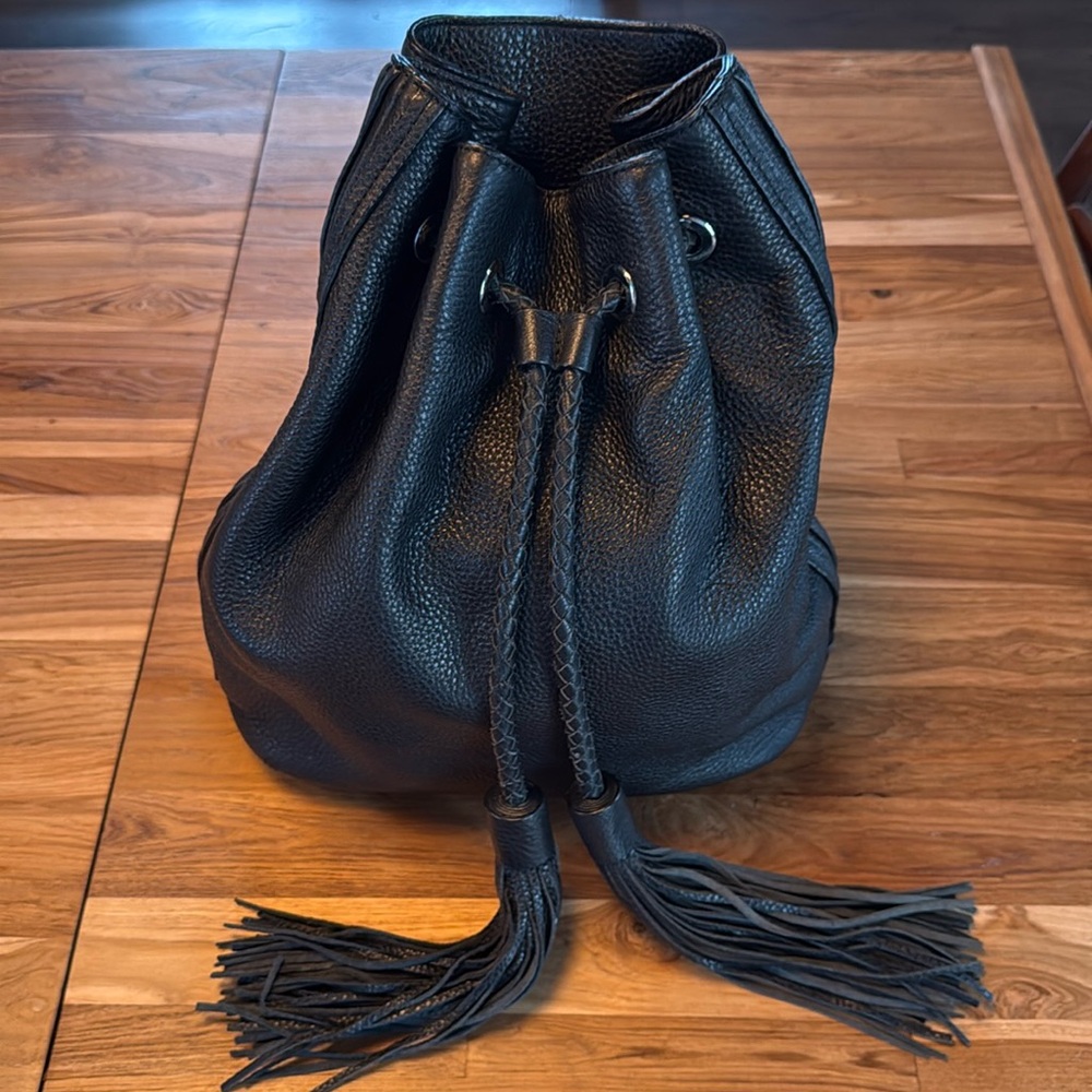 Rebecca Minkoff leather backpack with tassels. Good condition.